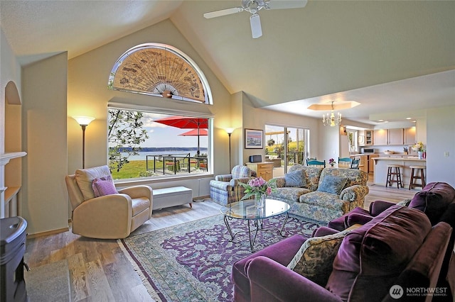478 Eagle Crest Rd, Camano Island, WA 98282 - living area featuring high vaulted ceiling, light wood-style floors, a chandelier, and ceiling fan