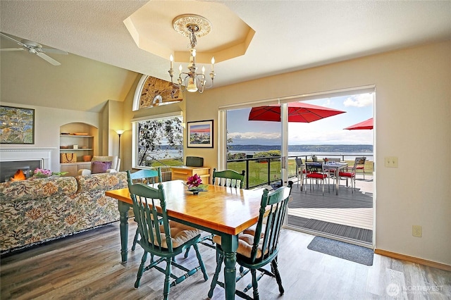 478 Eagle Crest Rd, Camano Island, WA 98282 - dining space featuring healthy amount of natural light, wood finished floors, baseboards, and built in shelves