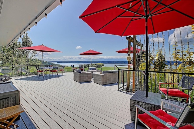 478 Eagle Crest Rd, Camano Island, WA 98282 - wooden deck featuring outdoor lounge area, a water view, and outdoor dining space