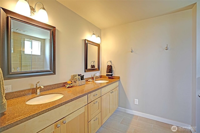 478 Eagle Crest Rd, Camano Island, WA 98282 - bathroom featuring double vanity and baseboards