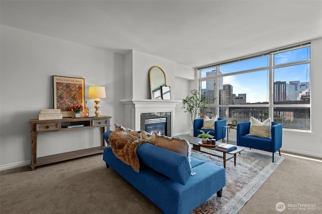 1420 Terry Ave Unit 1203, Seattle, WA 98101 - carpeted living area featuring a fireplace, a city view, and baseboards