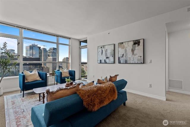 1420 Terry Ave Unit 1203, Seattle, WA 98101 - living room featuring healthy amount of natural light, carpet flooring, a view of skyline, and baseboards