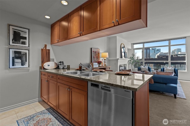 1420 Terry Ave Unit 1203, Seattle, WA 98101 - kitchen featuring dishwasher, a sink, brown cabinets, baseboards, and recessed lighting