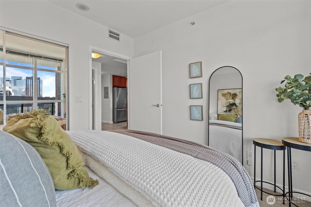 1420 Terry Ave Unit 1203, Seattle, WA 98101 - bedroom with freestanding refrigerator