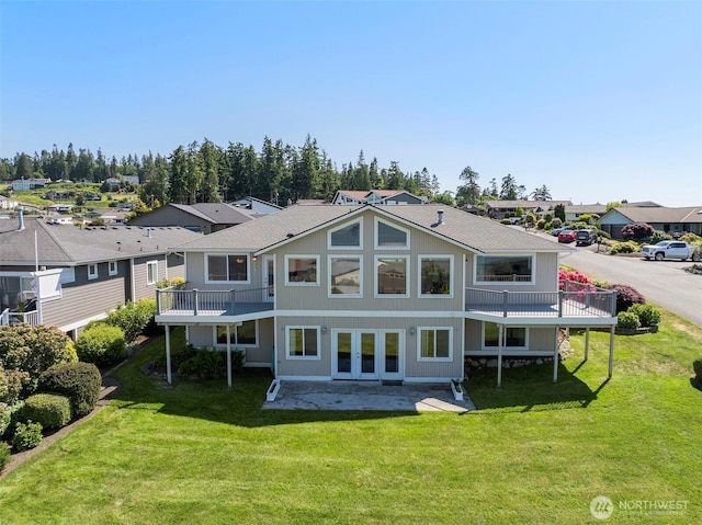 1042 Shorecrest Pl, Camano Island, WA 98282 - rear view of property featuring a patio, a lawn, a residential view, and roof with shingles