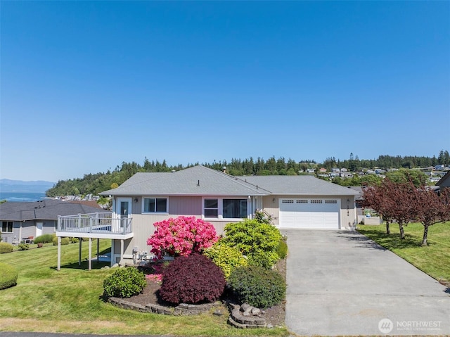 1042 Shorecrest Pl, Camano Island, WA 98282 - ranch-style house with an attached garage, concrete driveway, a front yard, and a deck