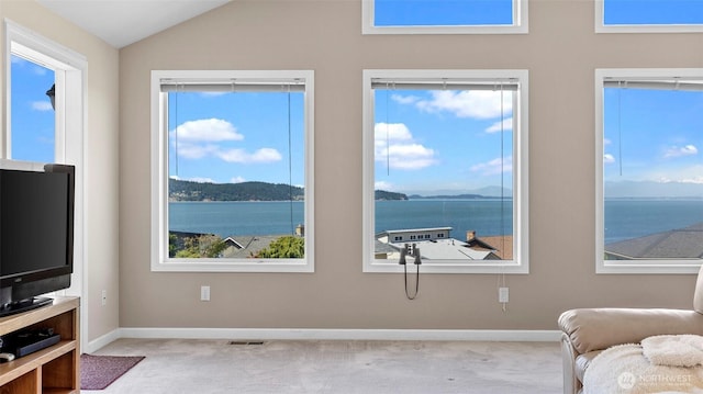 1042 Shorecrest Pl, Camano Island, WA 98282 - living area featuring carpet, vaulted ceiling, a water and mountain view, and plenty of natural light