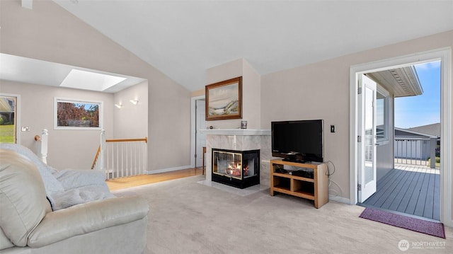 1042 Shorecrest Pl, Camano Island, WA 98282 - living room with light carpet, a skylight, a fireplace, and vaulted ceiling
