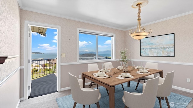 1042 Shorecrest Pl, Camano Island, WA 98282 - carpeted dining area featuring healthy amount of natural light, ornamental molding, and a water view