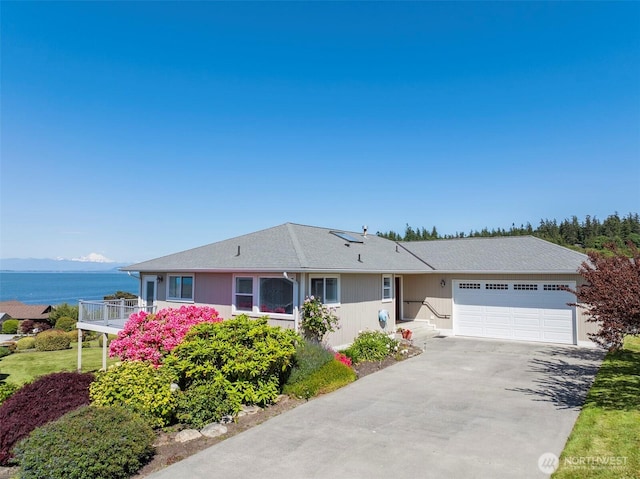 1042 Shorecrest Pl, Camano Island, WA 98282 - ranch-style home with a garage, driveway, and a water view