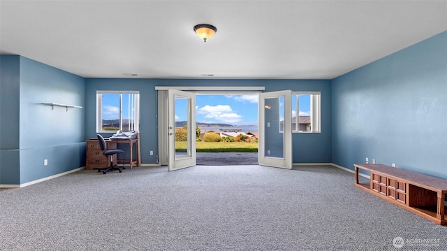 1042 Shorecrest Pl, Camano Island, WA 98282 - unfurnished office with healthy amount of natural light, carpet flooring, and french doors
