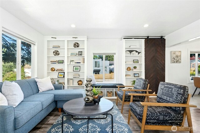 10056 Interlake Ave N, Seattle, WA 98133 - living room with plenty of natural light, a barn door, wood finished floors, and recessed lighting