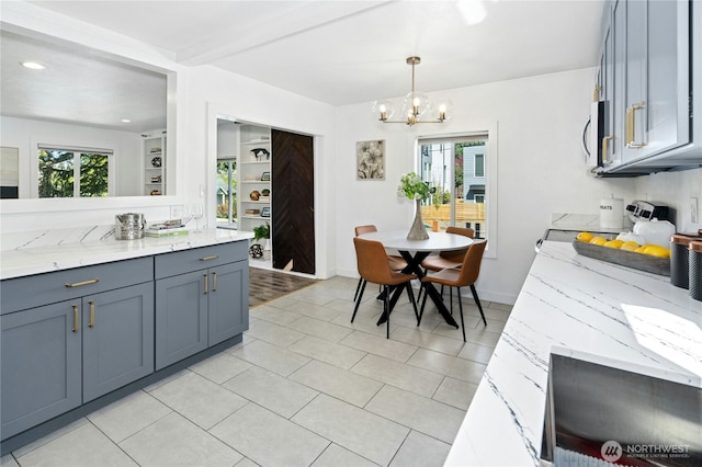 10056 Interlake Ave N, Seattle, WA 98133 - kitchen featuring a chandelier, plenty of natural light, light stone counters, decorative light fixtures, and recessed lighting