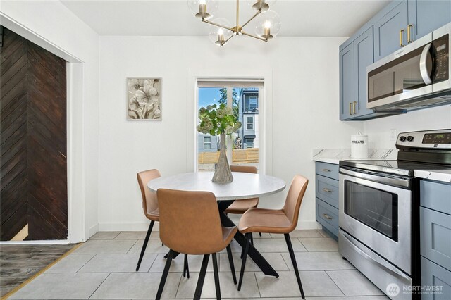 10056 Interlake Ave N, Seattle, WA 98133 - dining area with a chandelier, light tile patterned floors, and baseboards
