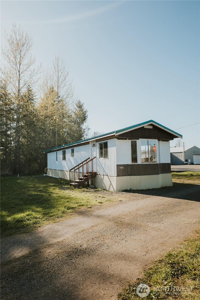 30 G St, Forks, WA 98331 - manufactured / mobile home with driveway and a front lawn