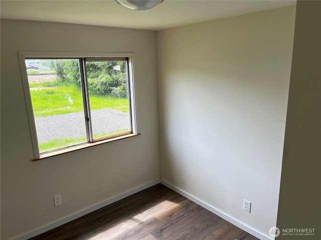 30 G St, Forks, WA 98331 - unfurnished room with wood finished floors and baseboards