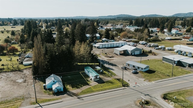 30 G St, Forks, WA 98331 - aerial overview of property's location featuring property boundaries highlighted and a mountainous background