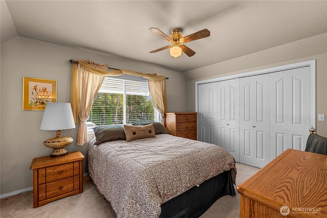2509 Boston Ave NW, East Wenatchee, WA 98802 - bedroom featuring light colored carpet, lofted ceiling, a closet, baseboards, and a ceiling fan