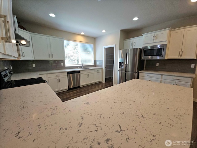 1901 78th Pl SE, Everett, WA 98203 - kitchen with appliances with stainless steel finishes, recessed lighting, dark wood-style floors, decorative backsplash, and white cabinetry