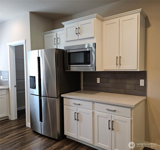1901 78th Pl SE, Everett, WA 98203 - kitchen with stainless steel appliances, decorative backsplash, dark wood finished floors, and white cabinetry