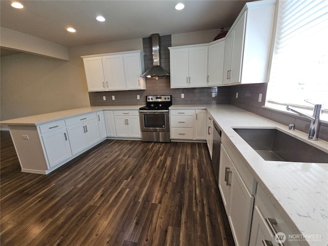 1901 78th Pl SE, Everett, WA 98203 - kitchen with electric stove, wall chimney range hood, a peninsula, white cabinetry, and recessed lighting
