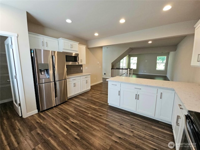 1901 78th Pl SE, Everett, WA 98203 - kitchen with appliances with stainless steel finishes, dark wood-style flooring, white cabinetry, recessed lighting, and light stone countertops