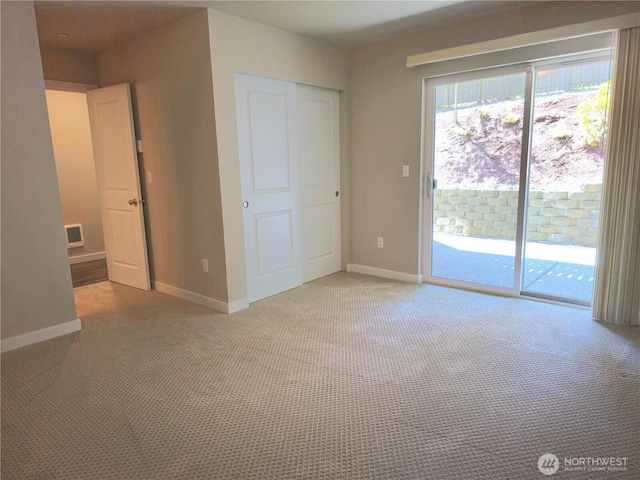 1901 78th Pl SE, Everett, WA 98203 - unfurnished bedroom with access to outside, carpet floors, and a closet