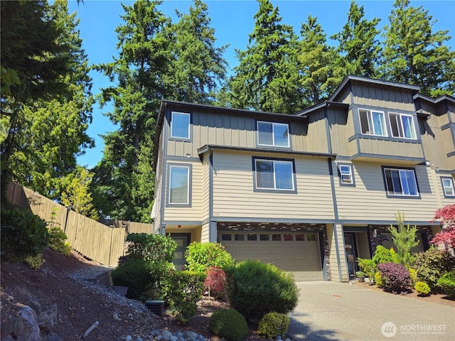 1901 78th Pl SE, Everett, WA 98203 - view of property with board and batten siding, a garage, and concrete driveway