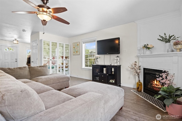 12524 SE 295th St, Auburn, WA 98092 - living room featuring ceiling fan, wood finished floors, a fireplace, and baseboards