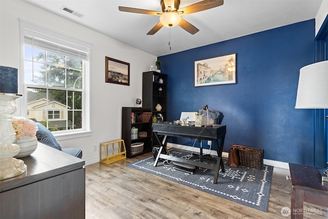 12524 SE 295th St, Auburn, WA 98092 - office featuring a ceiling fan, wood finished floors, baseboards, and an accent wall