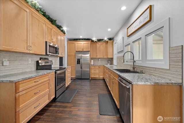 2722 112th St E, Tacoma, WA 98455 - kitchen with appliances with stainless steel finishes, a sink, light brown cabinetry, recessed lighting, and backsplash