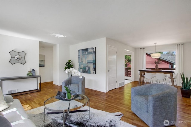 9030 6th Ave NW, Seattle, WA 98117 - living area with wood finished floors and baseboards