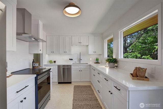 9030 6th Ave NW, Seattle, WA 98117 - kitchen featuring wall chimney range hood, stainless steel dishwasher, range with electric stovetop, a sink, and decorative backsplash