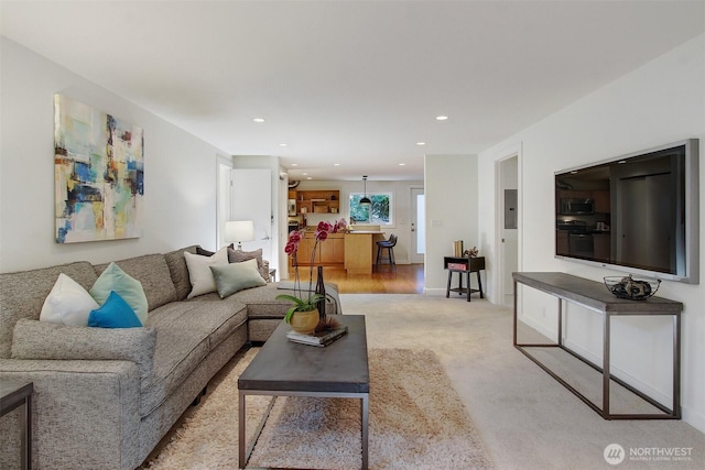 9030 6th Ave NW, Seattle, WA 98117 - living room featuring light colored carpet, recessed lighting, and electric panel
