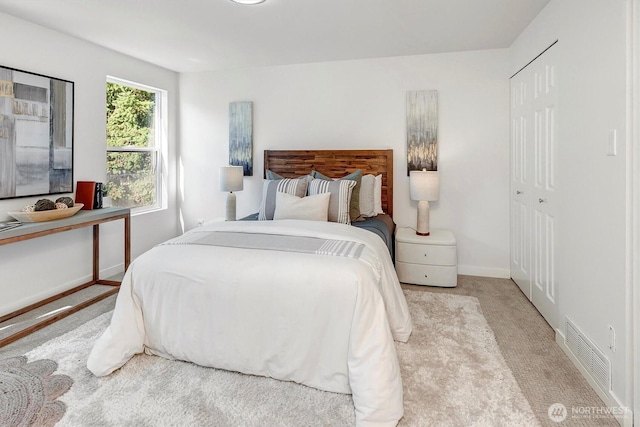 6128 202nd St SW Unit 101, Lynnwood, WA 98036 - bedroom with carpet and a closet