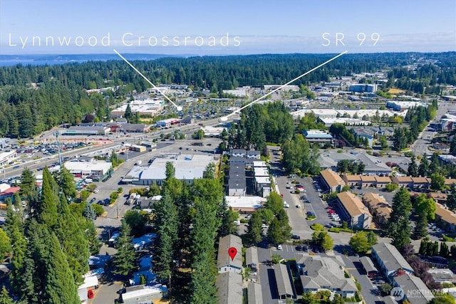 6128 202nd St SW Unit 101, Lynnwood, WA 98036 - aerial view of property and surrounding area with a forest