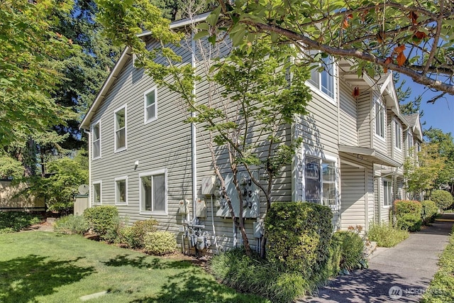 6128 202nd St SW Unit 101, Lynnwood, WA 98036 - view of side of property featuring a lawn