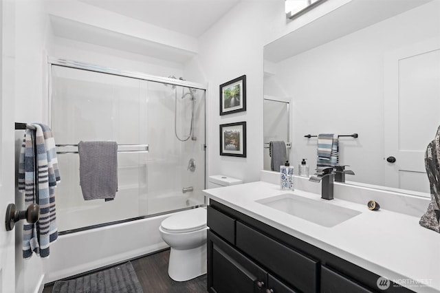 16100 SE 113th Pl, Renton, WA 98059 - full bath featuring toilet, vanity, shower / bath combination with glass door, and wood finished floors