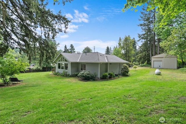 16100 SE 113th Pl, Renton, WA 98059 - back of house featuring an outdoor structure, a yard, and a garage