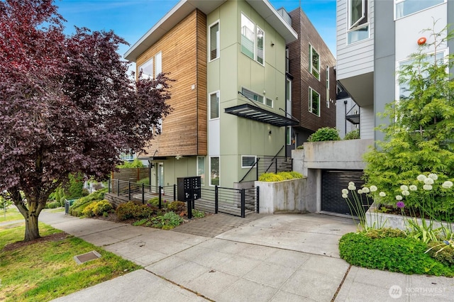 3923 2nd Ave NE, Seattle, WA 98105 - view of property featuring concrete driveway
