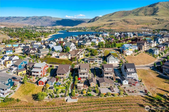 203 Bluebell Ct, Chelan, WA 98816 - aerial perspective of suburban area featuring a mountainous background