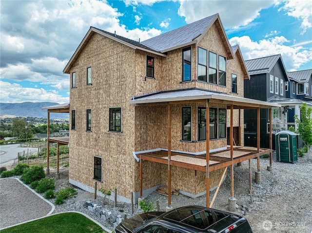 203 Bluebell Ct, Chelan, WA 98816 - rear view of house featuring a standing seam roof, metal roof, central AC unit, and a mountain view