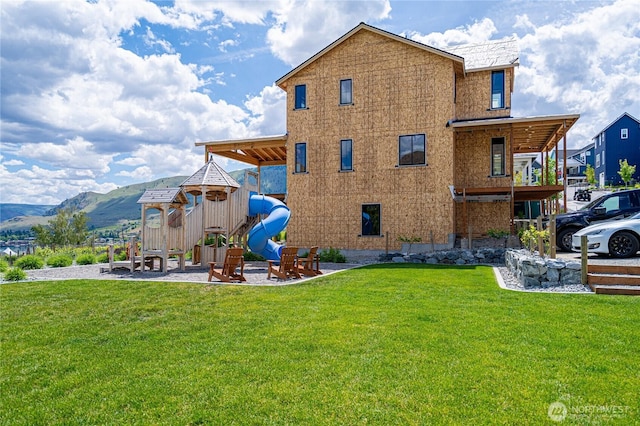 203 Bluebell Ct, Chelan, WA 98816 - rear view of property with a yard and a mountain view