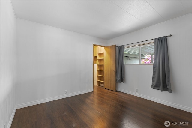 11216 127th St E Unit 19, Puyallup, WA 98374 - empty room with dark wood-style floors and baseboards