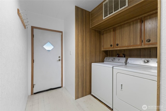 11216 127th St E Unit 19, Puyallup, WA 98374 - laundry area with cabinet space and washer and clothes dryer