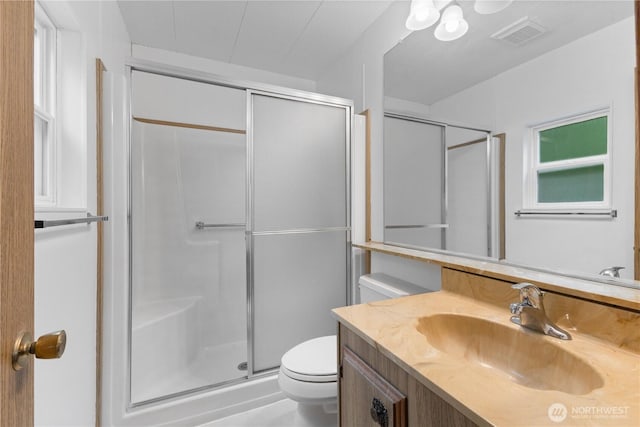 11216 127th St E Unit 19, Puyallup, WA 98374 - bathroom with toilet, a stall shower, and vanity