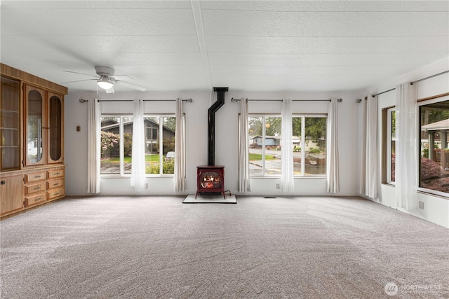 11216 127th St E Unit 19, Puyallup, WA 98374 - unfurnished sunroom featuring a wood stove