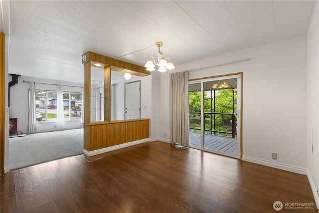 11216 127th St E Unit 19, Puyallup, WA 98374 - spare room featuring a chandelier, baseboards, and wood finished floors