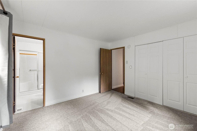 11216 127th St E Unit 19, Puyallup, WA 98374 - unfurnished bedroom with carpet floors, ensuite bathroom, a closet, and baseboards