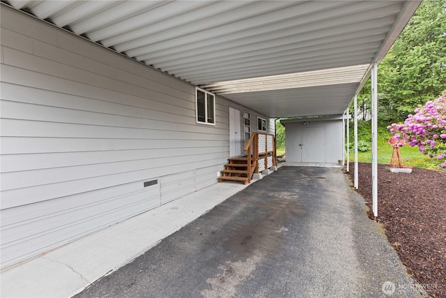 11216 127th St E Unit 19, Puyallup, WA 98374 - view of parking with a carport